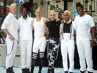 No Doubt members standing together for a group photo