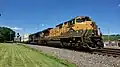 The Reading Railroad heritage unit, EMD SD70ACe #1067, leads an eastbound intermodal on track 2