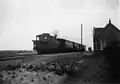 A locomotive of the series NS 7100 with a train at Metslawier station (1920–1940)
