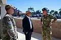 A Royal New Zealand Air Force officer, right. wearing NZMTP.