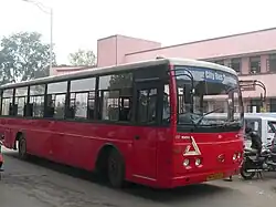 Red bus with large windows