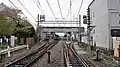 The station viewed from the level crossing at the east (Ikebukuro) end in April 2016