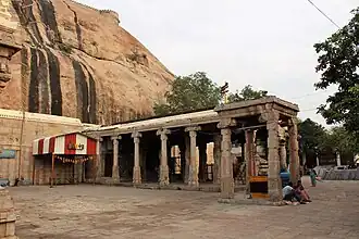 Sculpted pillared halls leading to the cave sanctum