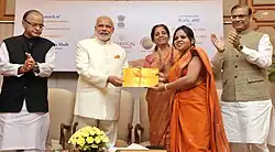 The Prime Minister, Shri Narendra Modi launches the Gold schemes, in New Delhi on 5 November 2015. The Union Minister for Finance, Corporate Affairs and Information & Broadcasting, Shri Arun Jaitley, the Minister of State for Finance, Shri Jayant Sinha and the Minister of State for Commerce & Industry (Independent Charge), Smt. Nirmala Sitharaman are also seen.