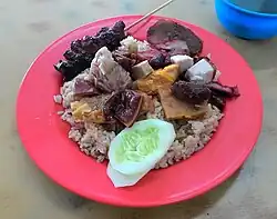 Chinese Indonesians nasi campur with pork satay