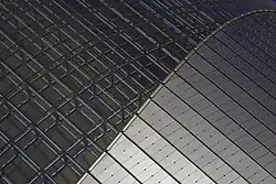 Building detail: transition from glass to titanium.