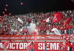 Nea Salamina Famagusta FC fans at Ammochostos Epistrofi Stadium in a game against Enosis Neon Paralimni FC in season 2006–07.