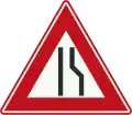 J18: Road narrows on the right side