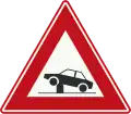 J39: Warning for retractable bollard (poller) in the traffic lane that can be used to regulate access to streets and areas.