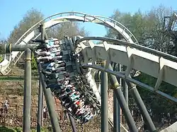 A Bolliger & Mabillard Inverted Roller Coaster train seats riders 4 across
