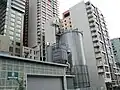 Wood handling building and storage silo