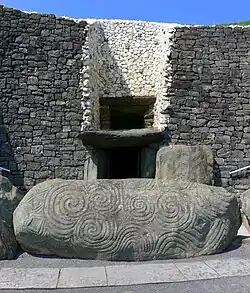 The entrance passage and entrance stone (the grey paving path is built for visitor access)