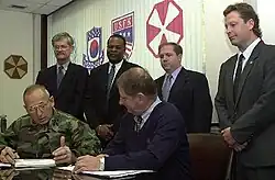 Image 27National Federation of Federal Employees officials sign a collective bargaining agreement with the U.S. 8th Army in October 2002.