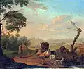 A shepherd and his herd near the water