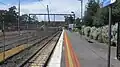 Northbound view from the station platform, with a derailed X'Trapolis train visible in the distance, November 2015