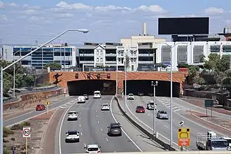 A dual carriageway road entering a tunnel