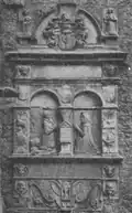A mural monument in late renaissance style showing a man in armour and a woman kneeling in prayer
