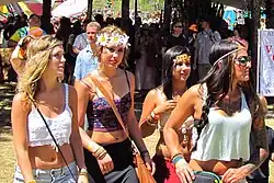 Image 64Women in Oregon wearing festival fashion including lace tops, maxi skirts, flower crowns, and stacked bracelets, 2013. (from 2010s in fashion)