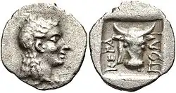 Obol from Ceramus. It has the head of the god Apollo and a Bucranium, 2 BC.