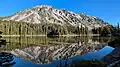 Old Desolate reflected in Mystic Lake