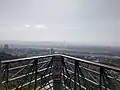 The old observation deck offers a distant view of Songshan Airport and Taipei 101.