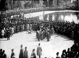 Pahlevani wrestling performance in Arg Square during the Qajar era