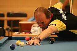 Ortmann aiming a shot