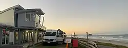 Omanu Surf Lifesaving Club building and beach