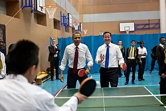 President Obama and Prime Minister David Cameron playing table tennis with students at Globe Academy