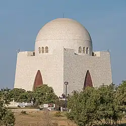 White-marble cuboid mausoleum topped by a dome