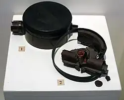 Two PMN-1 mines: the first example is complete, the other shows the appearance of a PMN-1 after it has detonated