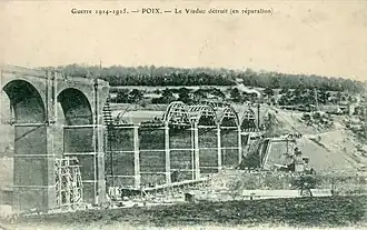 The railway viaduct, under repair after destruction during World War I