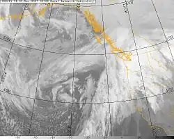 Satellite image of the Western United States, British Columbia, and Pacific Ocean, with the states of the US shown in orange lines. The Great Coastal Gale of 2007 storm is visible as a mass of clouds over the Pacific Ocean and parts of North America.