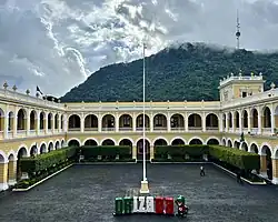 Palacio Municipal de Orizaba, interior courtyard of majestic 2-story government building with arches.