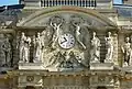 Allegorical statues flanking the clock of Palais du Luxembourg