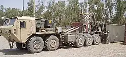 Oshkosh M1075A0 PLS truck fitted with the Armor Holdings developed protection package