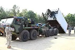 Oshkosh M1075A0 PLS truck showing the LHS and CHU