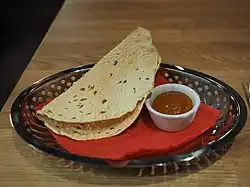 Papadam with chutney served as an appetizer at a South Asian style restaurant in Finland
