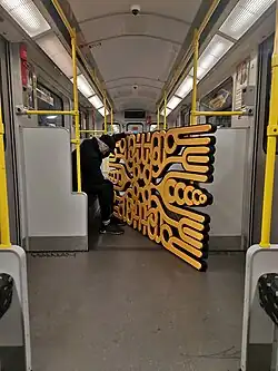 Mr. Paradox Paradise with sculpture in Metro U1