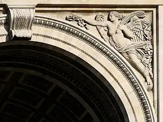 Figure of Victoria (northern façade, right spandrel)