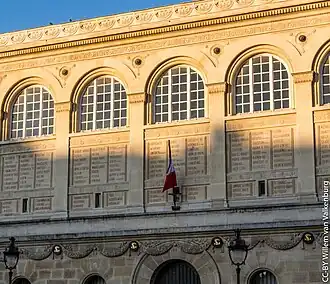 Neoclassical Doric pilasters with arches on the entrance front façade of the Sainte-Geneviève Library, Paris, designed by Henri Labrouste in 1838–1839, built in 1834–1850[27]