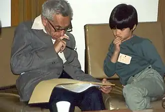 Paul Erdős (left) teaching a young Terence Tao (right).
