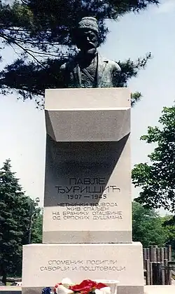 a concrete plinth with a bust on top of it