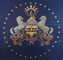 A Pennsylvania state flag from 1863, featuring a ring of stars around the coat of arms. It was made in November 1863 by a Philadelphia flag manufacturer for Governor Curtin's use during the Gettysburg National Cemetery's dedication on November 19, 1863.[35][36]
