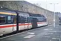 A high speed train power car and coach in InterCity Swallow livery