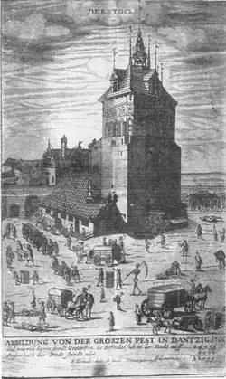 Contemporary woodcut showing the Great Plague in Danzig (1709): a fortified town gate and tower dominate the scene while carts transport bodies, grave diggers work, and townspeople move through the streets; German annotation below notes the death toll.