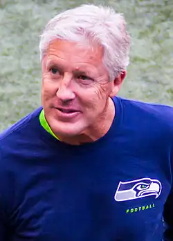 A color photograph of a man wearing a blue shirt