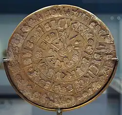 Image 19alt=Spiral hieroglyphic inscriptions on the Phaistos Disc (from Comparative mythology)