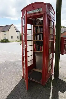 Red phone box now used as a book swap in Wall, Staffordshire, England