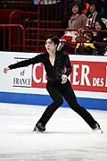 Keiji Tanaka begins the take-off of a Salchow